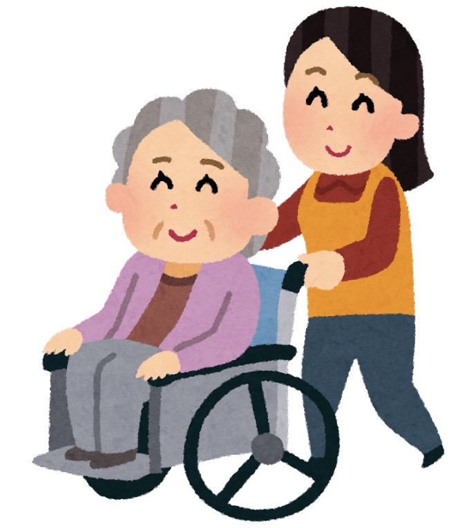 車いすで介護をしているイラスト